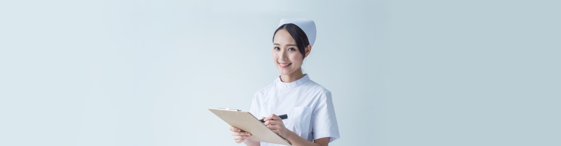 nurse writing on her notes